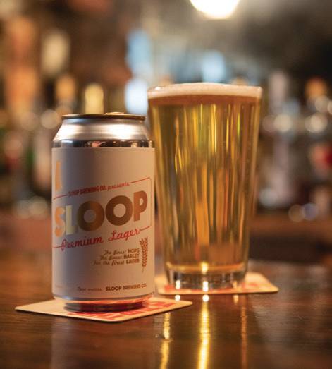 Sip on Sloop’s Premium Lager, available to purchase in 12 packs.